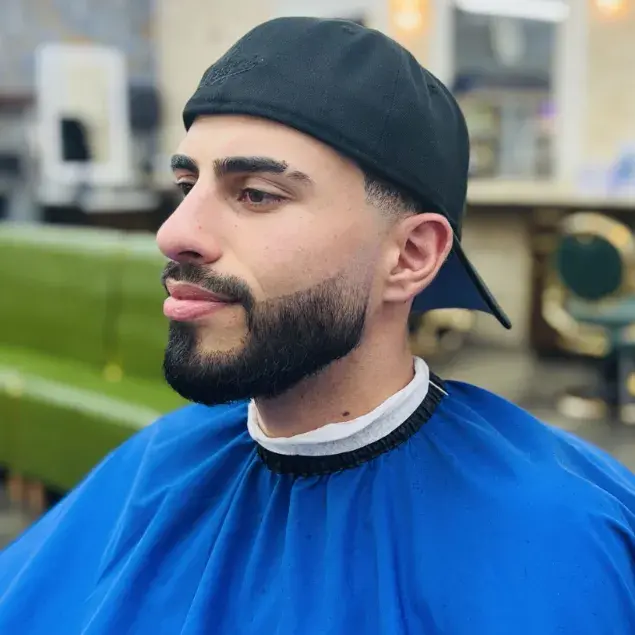 Full beard shaped and lined up with a sharp cheek line
